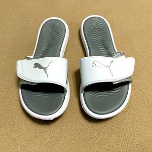 Woman’s white PUMA flip flop
